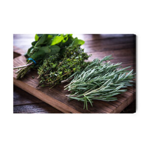 Leinwandbild Kräuterbündel Auf Einem Holzbrett